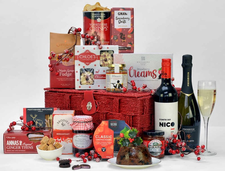 ;;Red Gift Basket filled with Prosecco, wine and Christmas themed food.