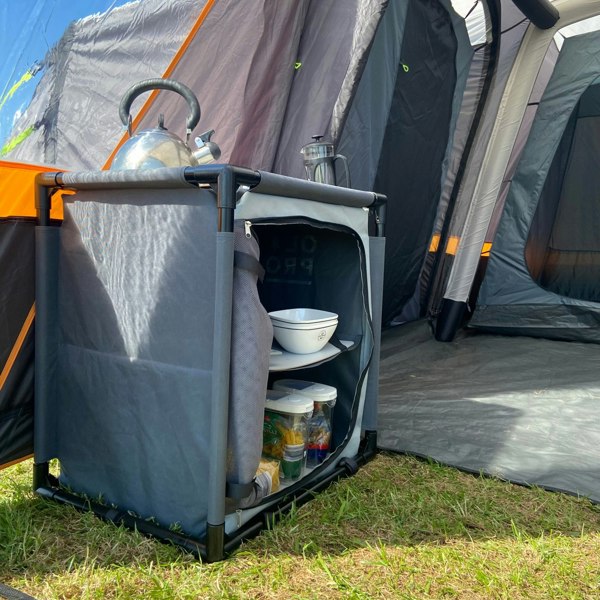 An image of the Camp Storage Cupboard from OLPRO being used as storage for food and cutlery.