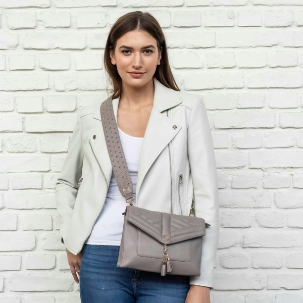 ready for every adventure with harry warm grey leather crossbody bag worn with matching stevie studded leather crossbody strap