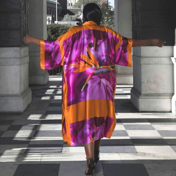 Bird of Paradise Pink Purple Plus Size and Mid Size Silk Kimono shown from the back, with the model wearing heels for an elegant appearance.