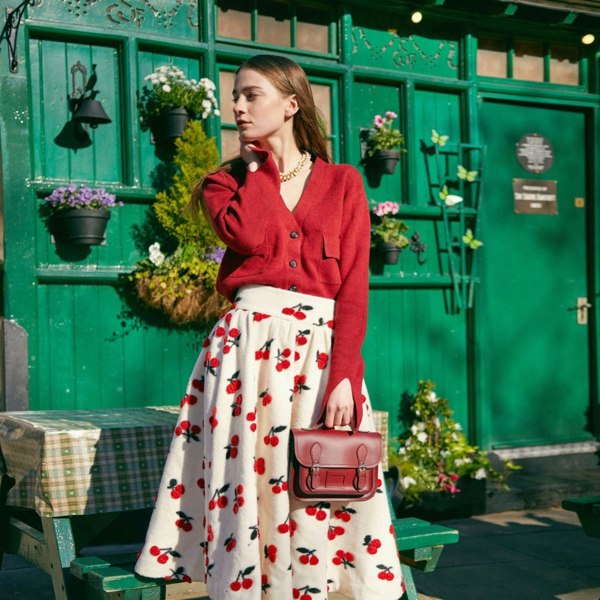 Model carries the Oxblood Midi Satchel