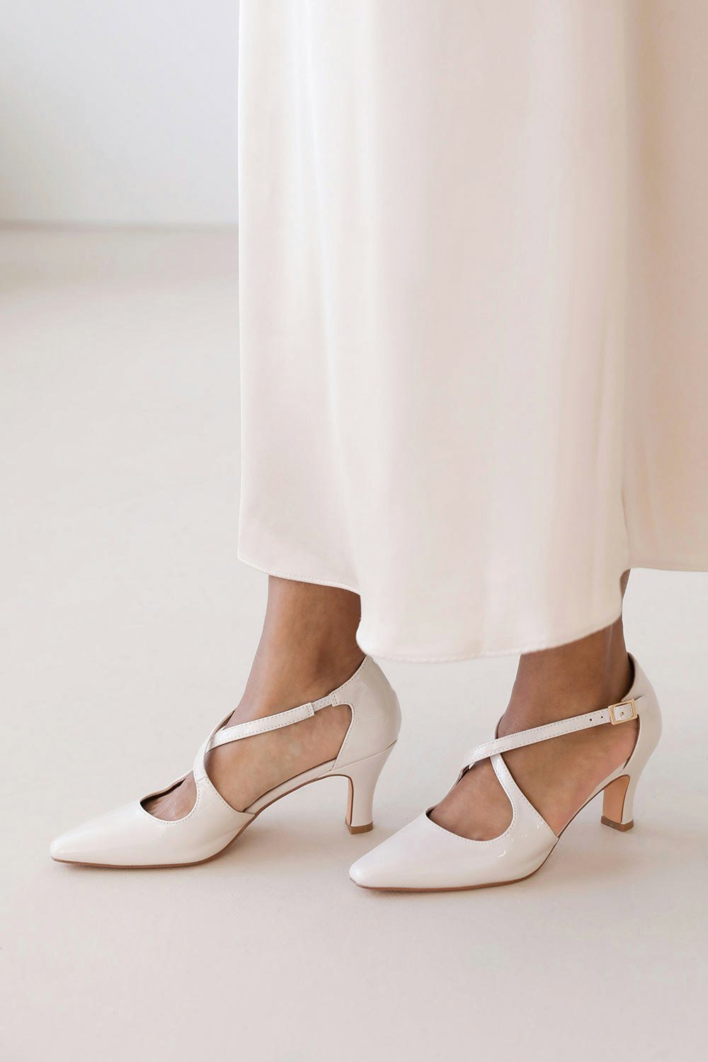 Where's That From Loreza Cross Over Strap Mid Block Heel in Cream Patent