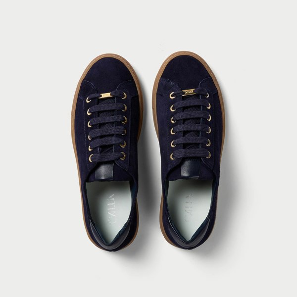 top view of a pair of navy suede trainers