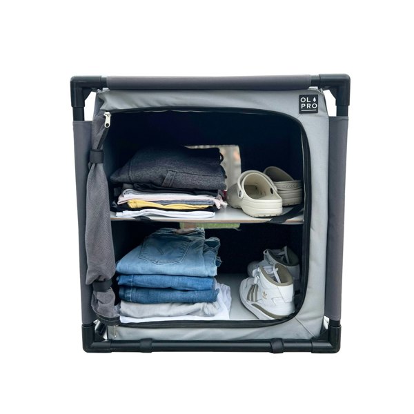 An image of the Camp Storage Cupboard from OLPRO being used as storage for clothing items.