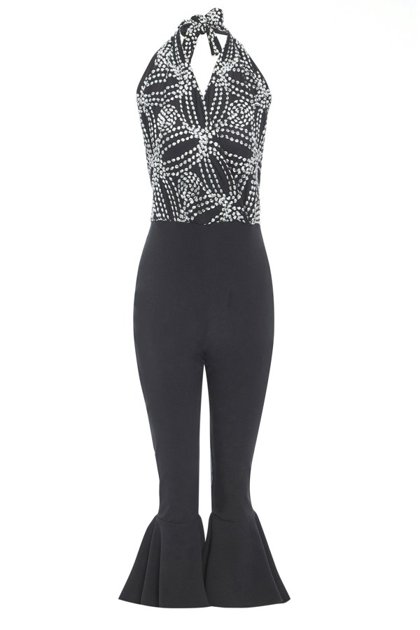 a Sarvin Black Backless Jumpsuit with a halter neck.