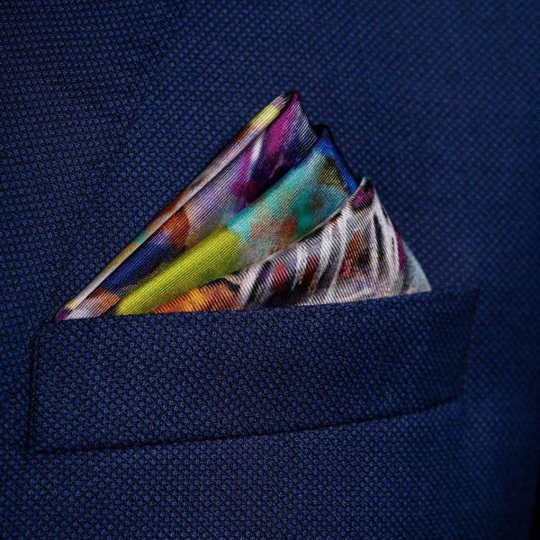 American football silk pocket square in red, white & purple by Otway & Orford folded in top pocket