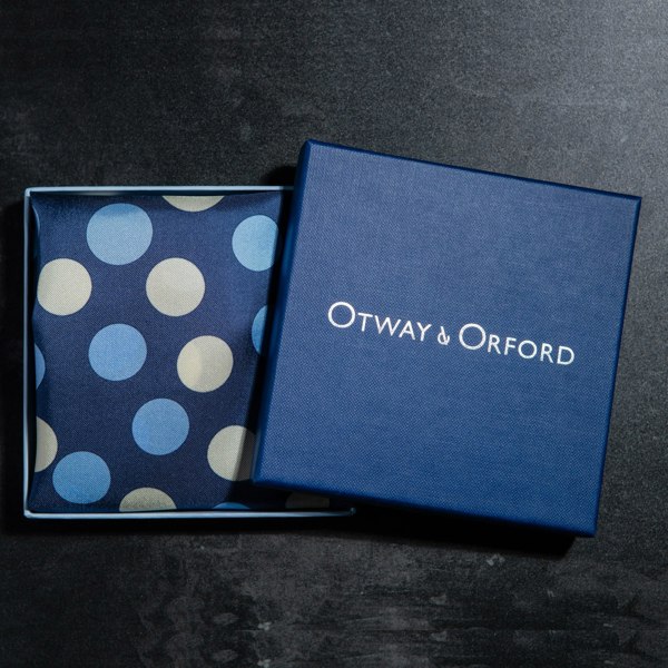 Polka dots design silk pocket square in blue with pale blue and off-white by Otway & Orford folded in gift box