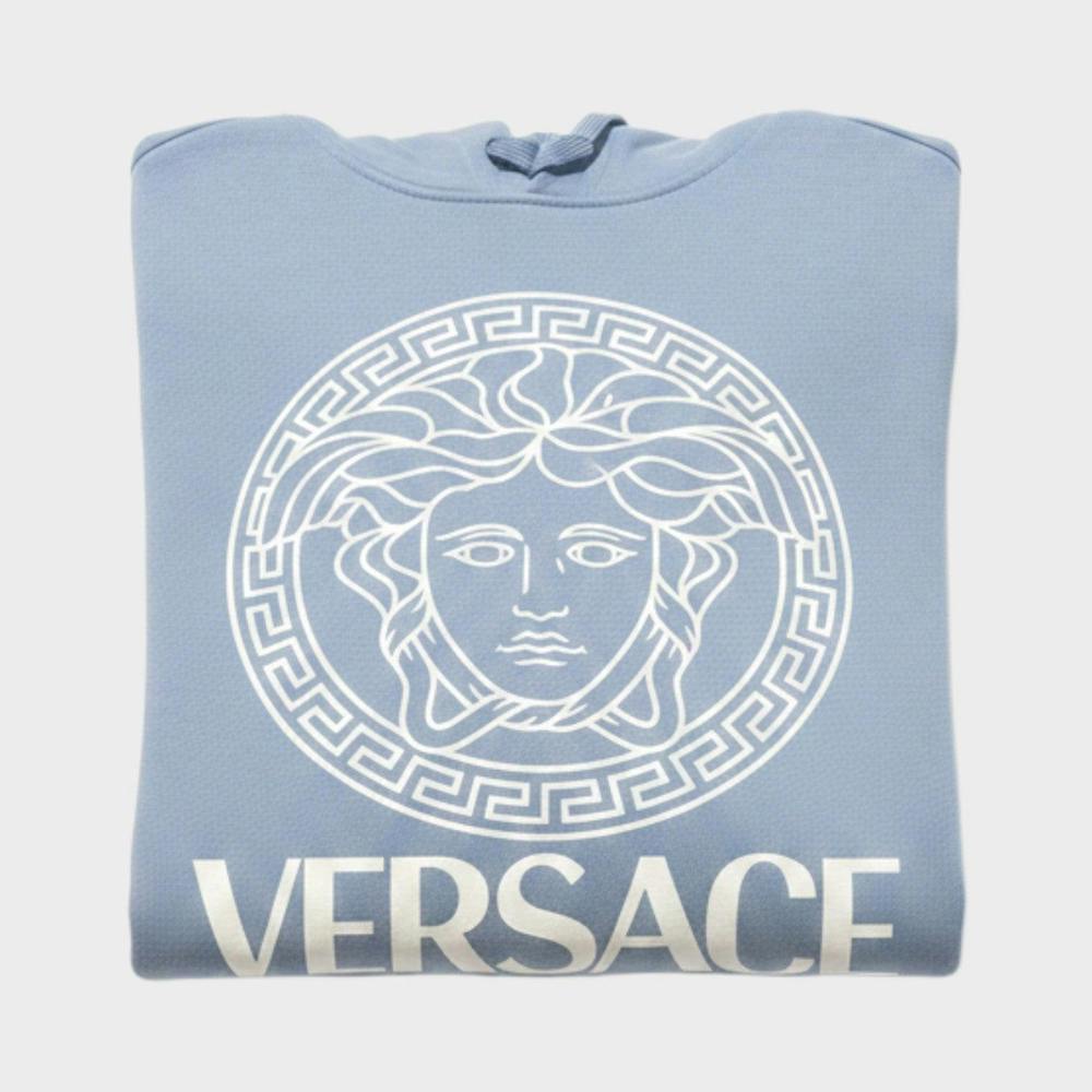 Supplied Fashion baby blue hoodie featuring a white Medusa logo and Versace text in a folded flat lay view.