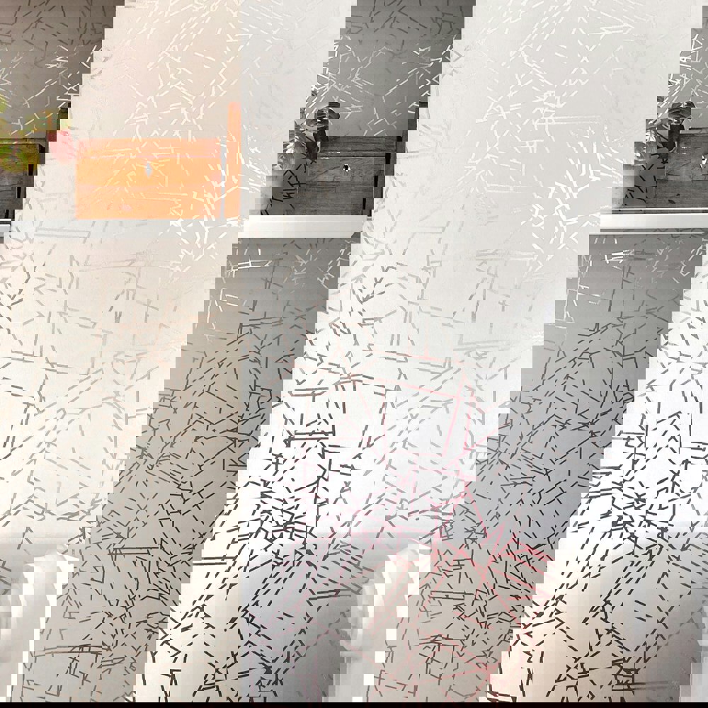 Angles pewter / white stone wallpaper by Erica Wakerly