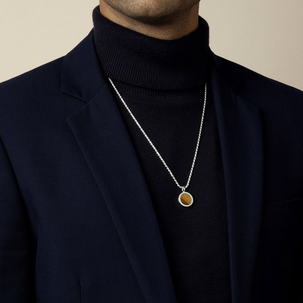 model wearing tigers eye amulet pendant with 1.8mm diamond cut rope chain in sterling silver