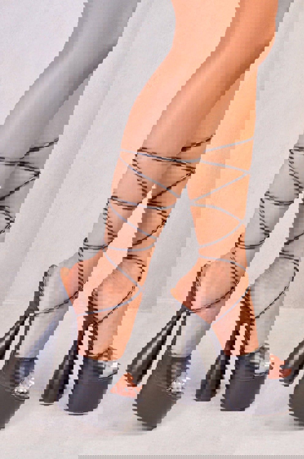 Where's That From Flared High Heels With a Leg Tie in Black Faux Leather
