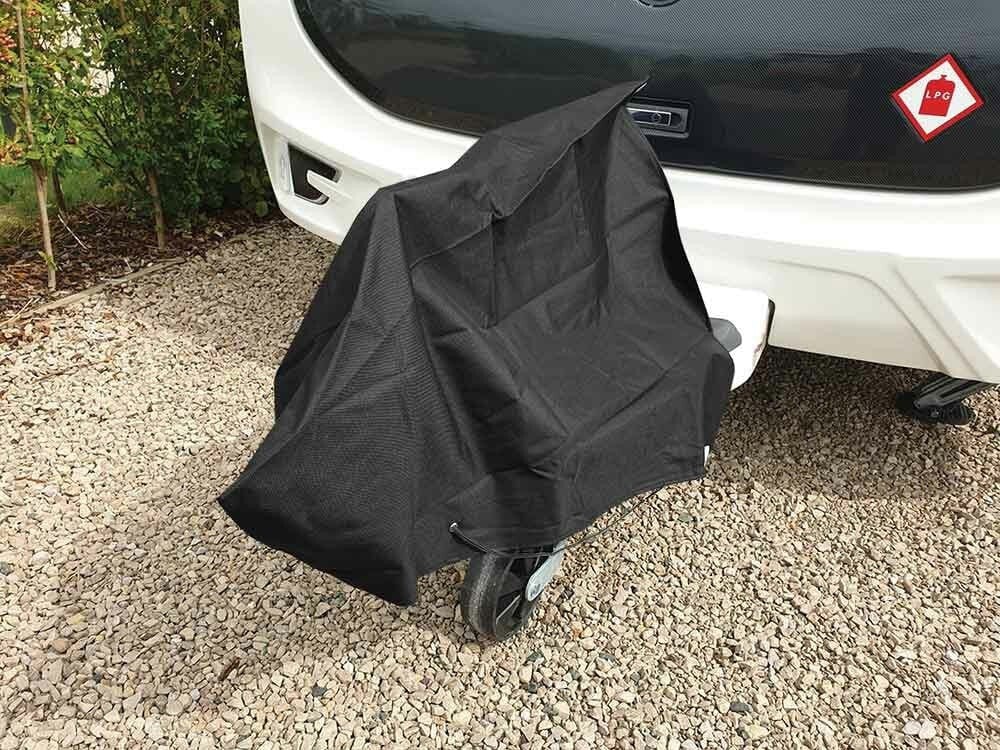 Image of the Caravan Hitch Cover by OLPRO fitted to a Caravan Hitch on a gravel driveway to illustrate how it looks when in use on a Caravan Hitch.