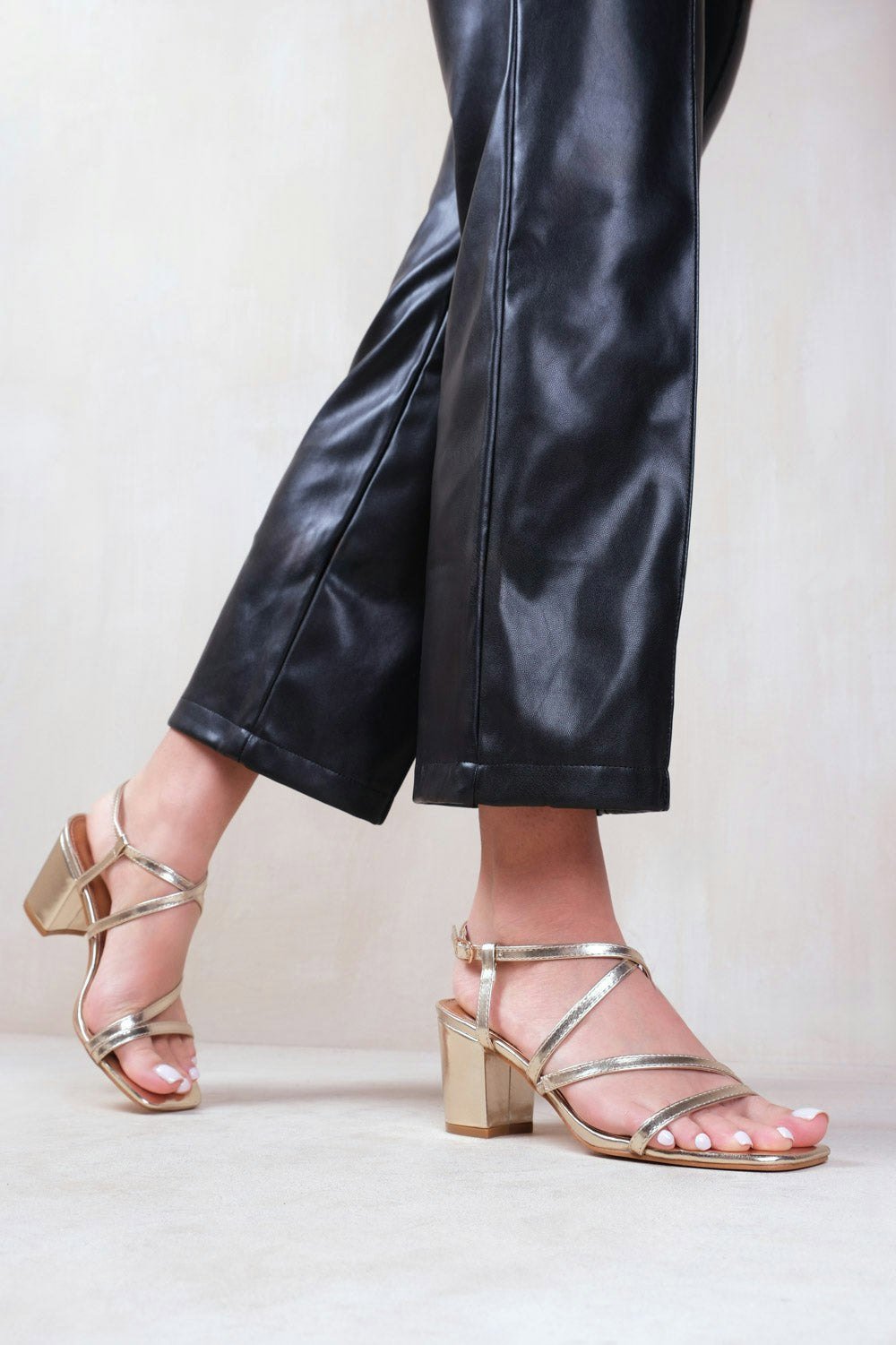 Where's That From Sidra Mid High Block Heel Sandals With Cross Over Strap in Gold Metallic Faux Leather