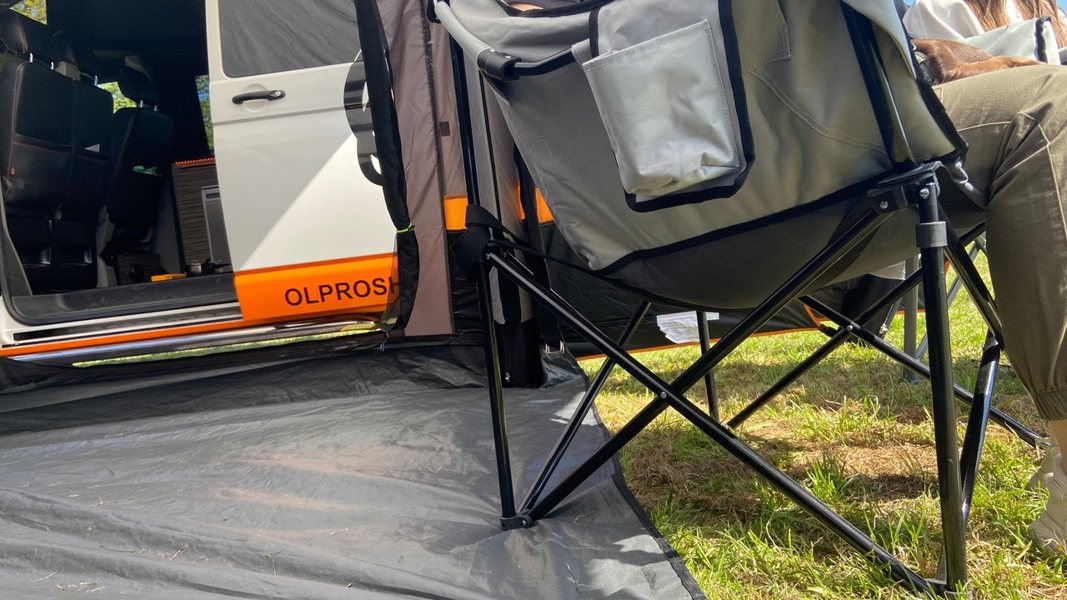 An image of the Olympus XL Camping Chair from OLPRO outside of a campervan.