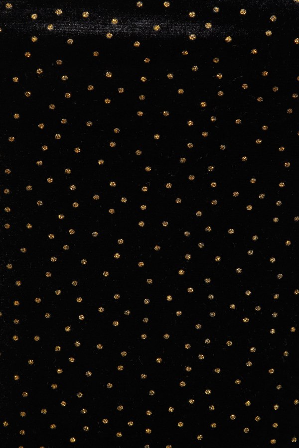 a Sarvin Gold Polka Dot Dress fabric.