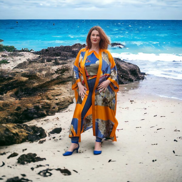 Bird of Paradise Cherry Blossom Silk Kimono paired with a Cherry Blossom Silk Scarf as a top. featuring elegant cherry blossom patterns with a beach background.