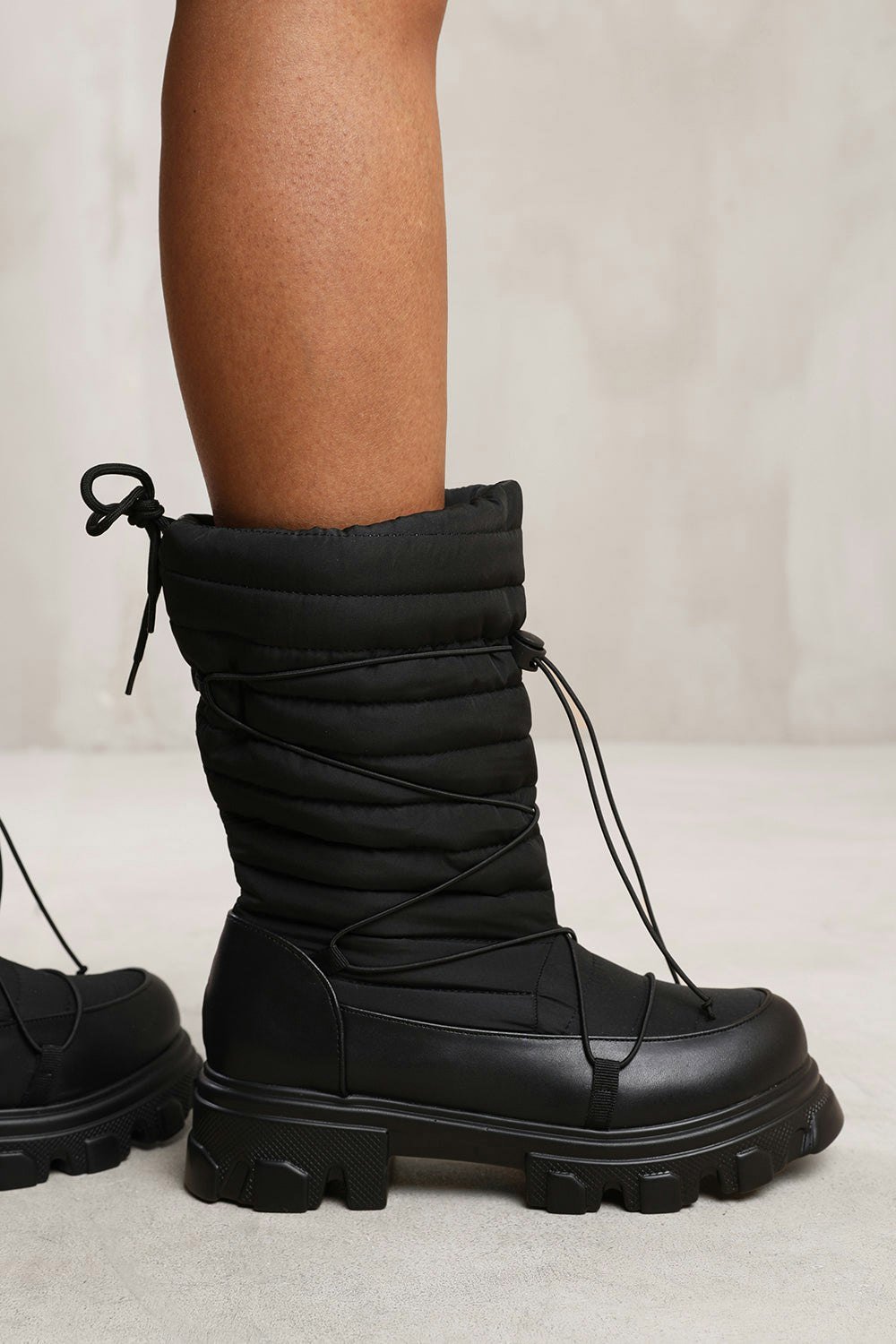 Where's That From Rosie Puffer Quilted Boot With Chunky Soles in Black