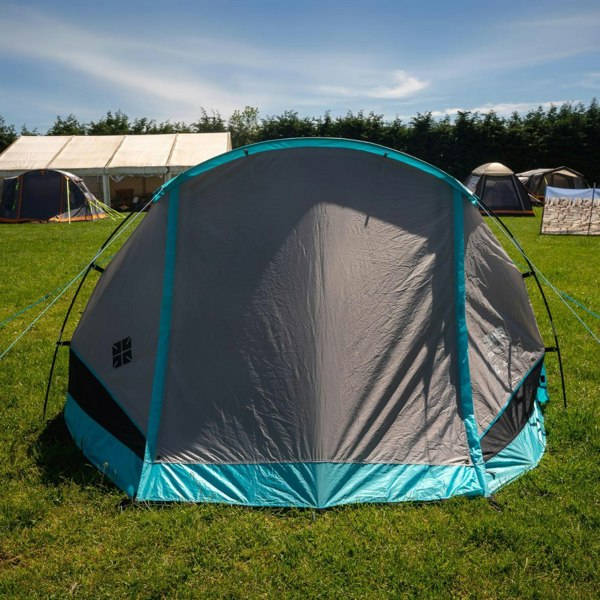 Stafford 3.0 OLPRO x Ed Stafford tent, photographed from the front on a campsite