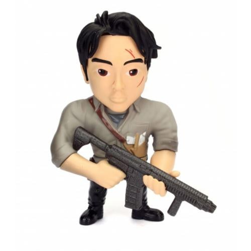 a toy figurine of a man holding a gun