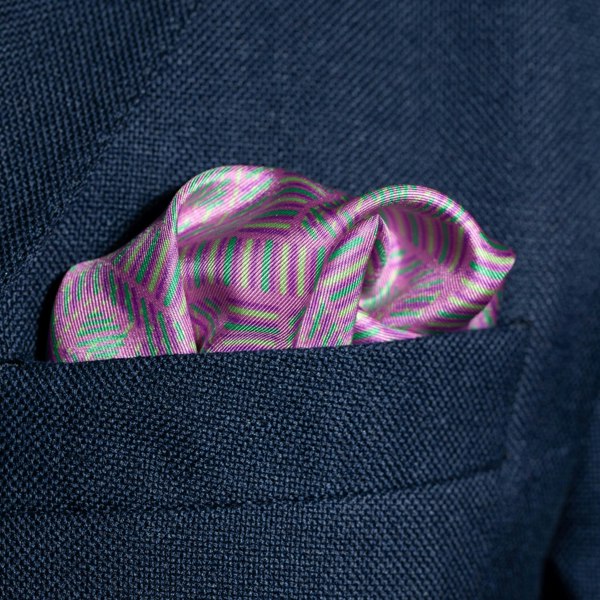 Squares design silk pocket square in deep pink with blue, mauve & green by Otway & Orford folded in top pocket