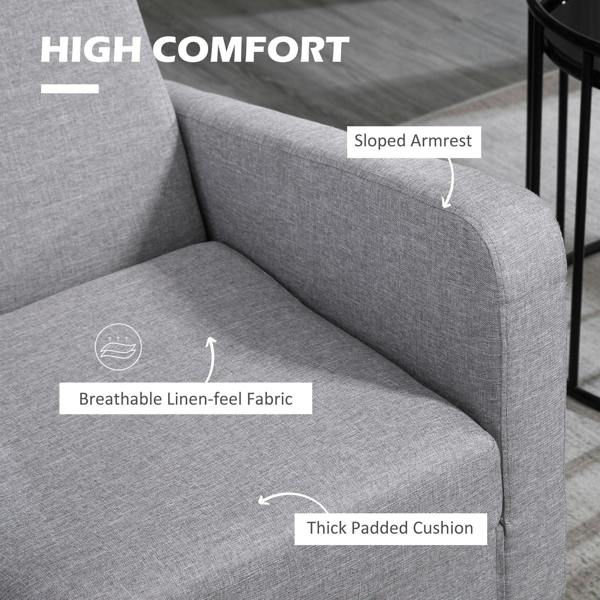 Light grey armchair with sloped armrest and thick padded seat cushion