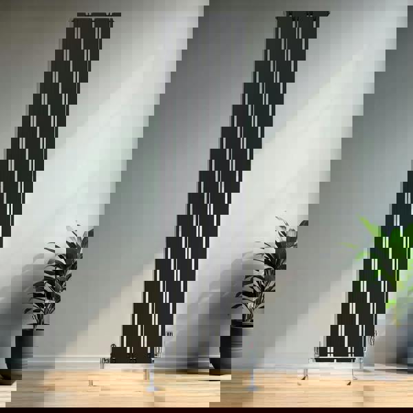 Sleek black flat single column radiator, 1800 x 420mm, featuring vertical bars and modern design, mounted in a stylish interior setting