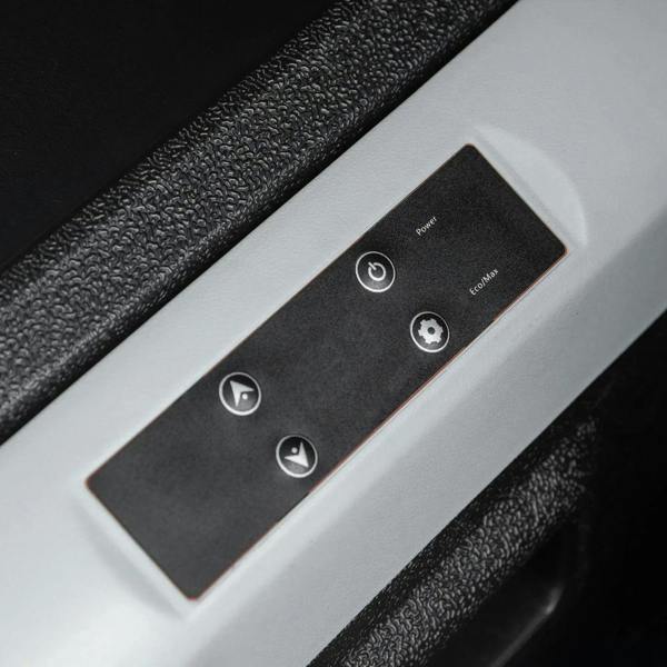 Close-up of cooler side buttons and power controls on black and white trim