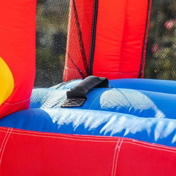 Close-up of reinforced inflatable bounce castle seam with black repair patch