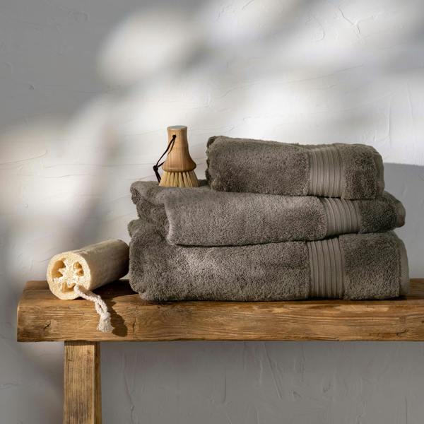 Mink Egyptian Cotton Towels styled in a bedroom | Soak and Sleep