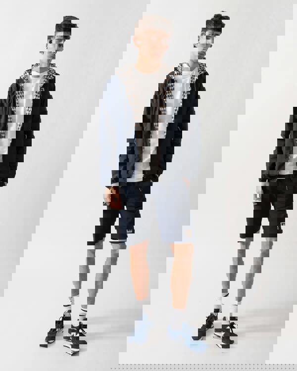 full length studio shot of a model wearing an Aquascutum Mens RLG Badge Reversible Sailor Jacket in Navy 11