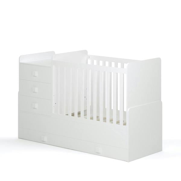 Side view of the white cot. It shows off the included pull out drawers and removable 3 drawer storage chest.