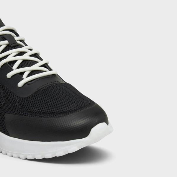 Supplied Fashion Eva Runner Low black mesh and leather sneaker with white laces and a white responsive sole