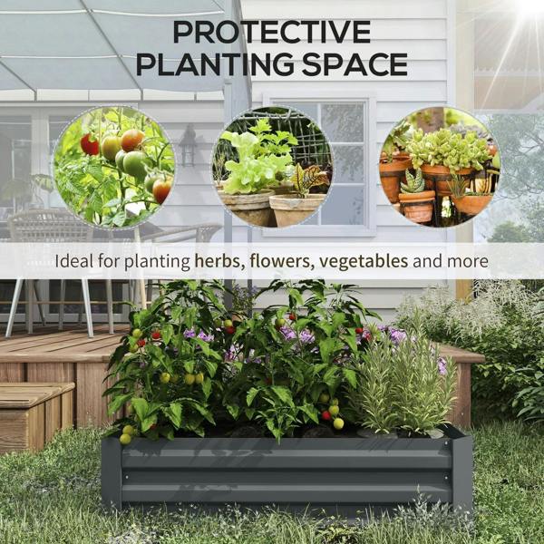 Dark grey raised garden bed filled with herbs, flowers, and leafy plants