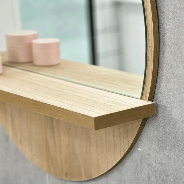Round mirror frame and shelf edge in natural wood-effect finish