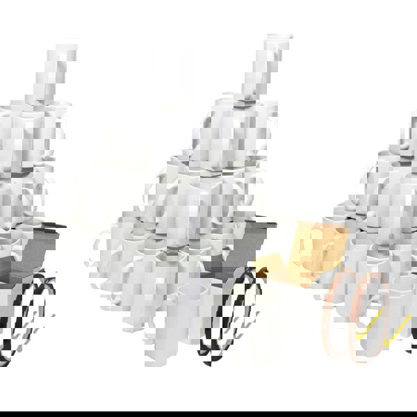 Stack of white ceramic mugs arranged in a pyramid with open and closed brown cardboard boxes and two rolls of heat-resistant .