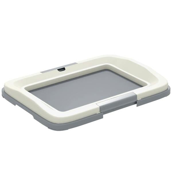 Grey dog litter tray with low sides and built-in raised rim for indoor/outdoor training