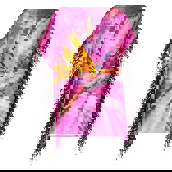 Pink purple top with bird of paradise flower design and  black feather trim on a white background