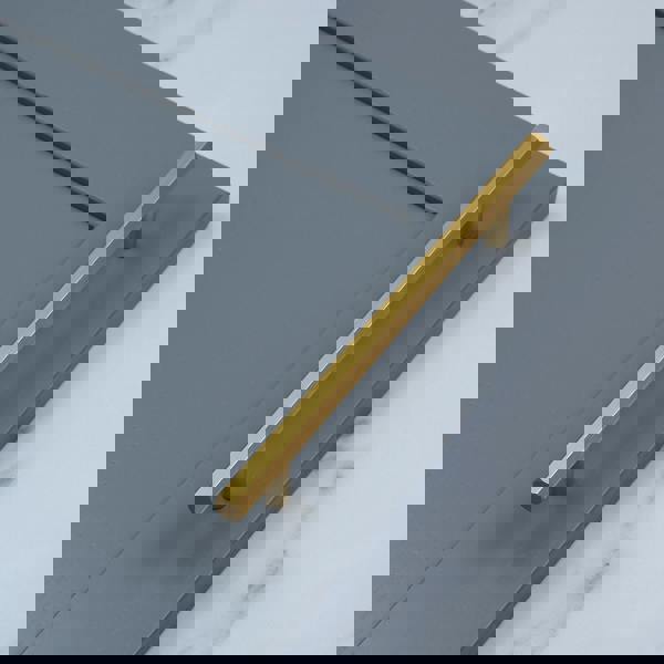 A brushed brass hexagonal T-bar handle