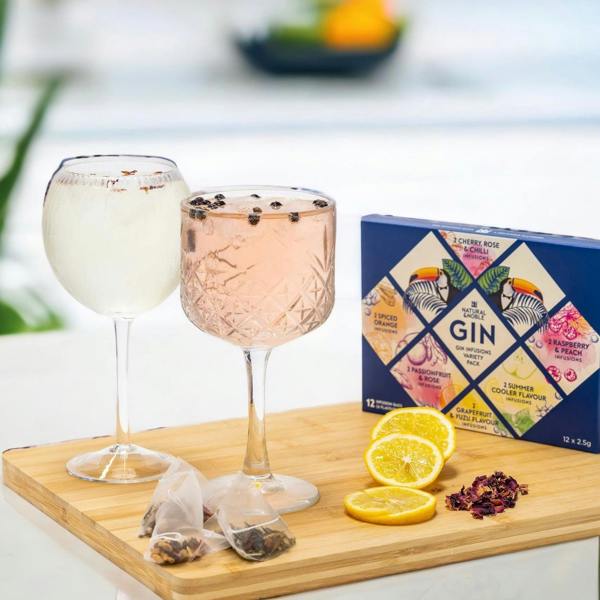 Natural & Noble Gin Infusion Bags Alongside Glasses of Infused Gin and Fresh Fruit