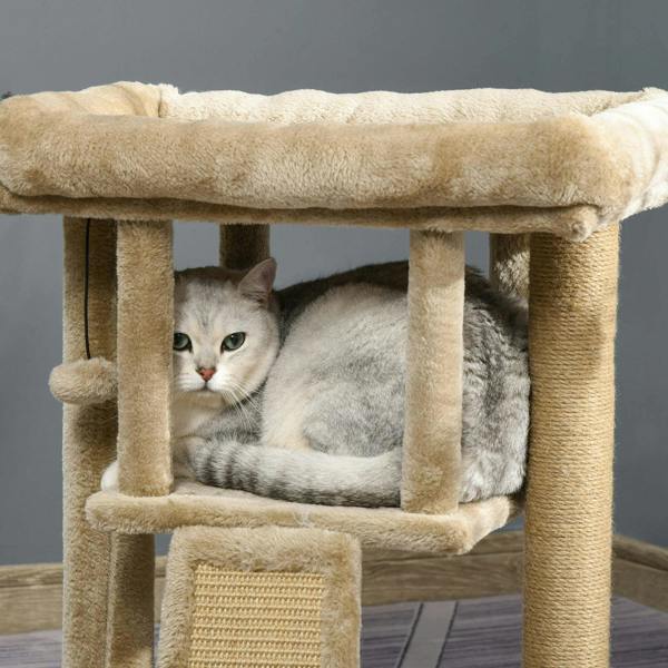 Brown cat tree tower with cushioned top perch and lower condo hide, featuring scratching pad