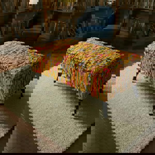 Rectangular storage ottoman with vibrant multi-toned abstract design