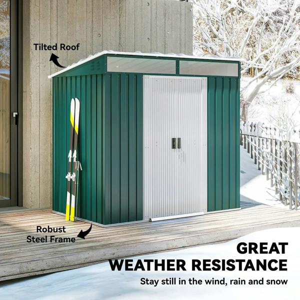 Green metal tool shed with tilted roof, closed double sliding doors and vent panels.