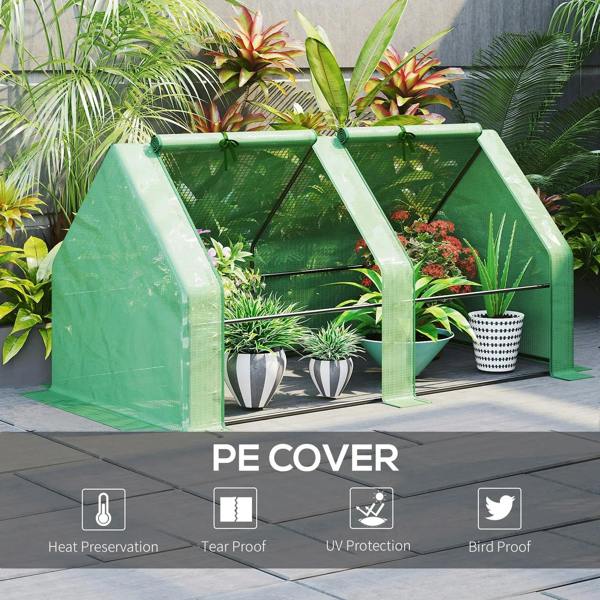 Green mini greenhouse with steel frame and PE cover, open roll-up door area