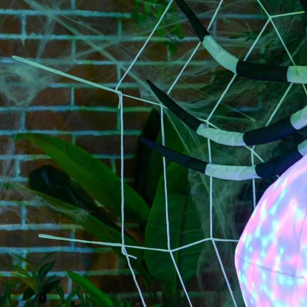 Inflatable spider legs and white web netting, with iridescent LED body edge