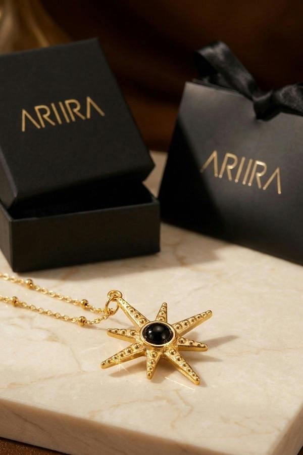 ARIIRA Gaia Gold Tone Starburst Pendant Necklace