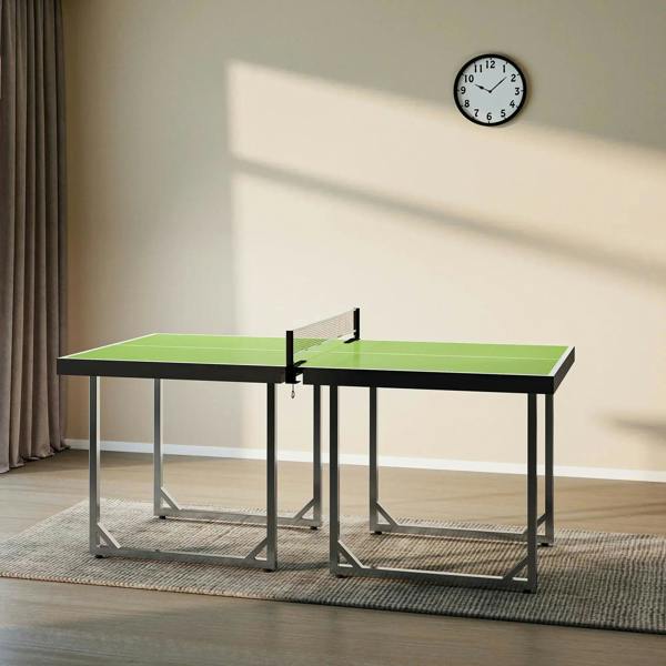 Green ping pong table with black net, two folding frames, and adjustable support legs.