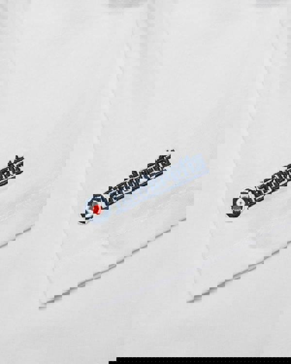 Lambretta Mens Multi Badges Mod Ska Casual T-Shirts, close-up of embroidered Lambretta logo on white fabric.