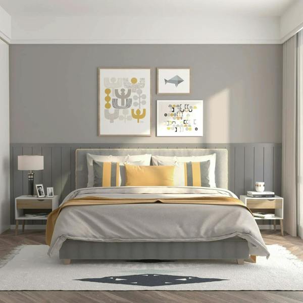 White nightstand with light wood drawer and open shelf beside a bed, on wooden legs.