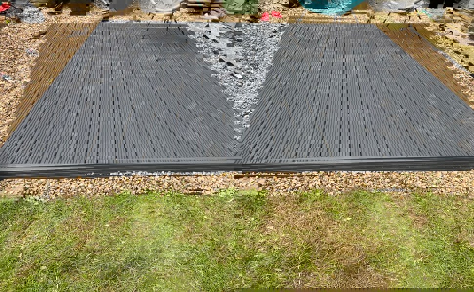 Gray composite deck on gravel