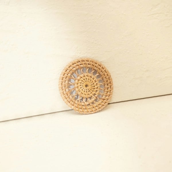White wash rattan spiral coaster lifestyle handwoven wicker table